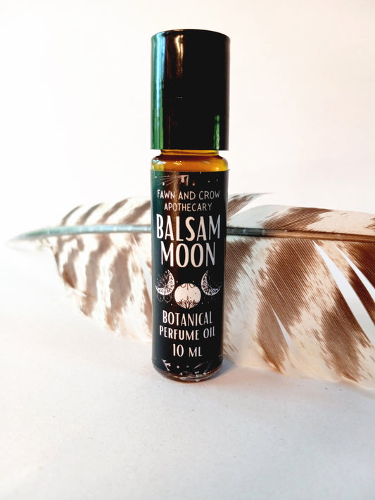 A bottle of Balsam Moon Botanical Perfume Oil made with Poplar Buds and Cloves.