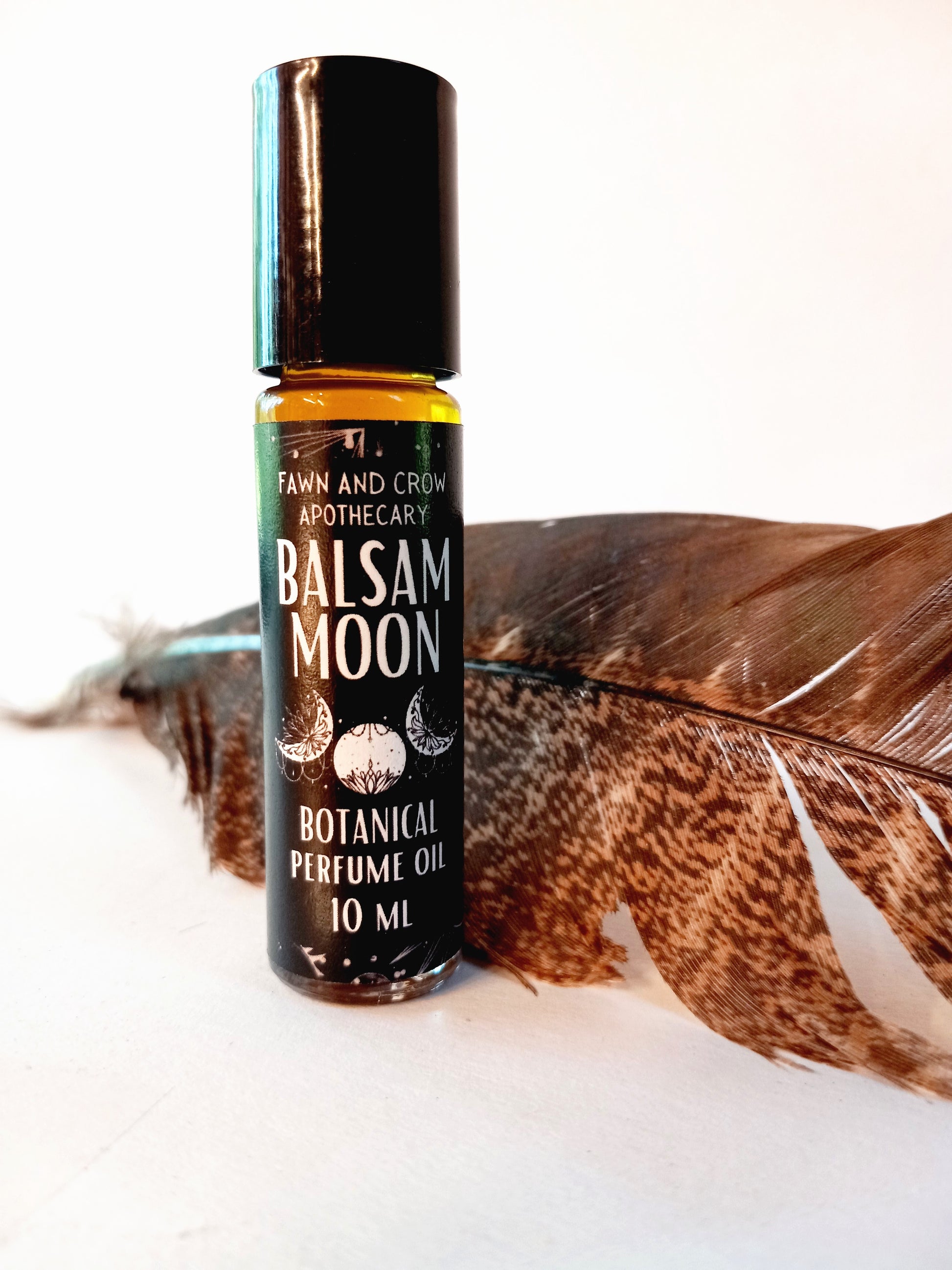 A bottle of Botanical Ritual perfume with Earthy, caramel, sweet and woody scents,