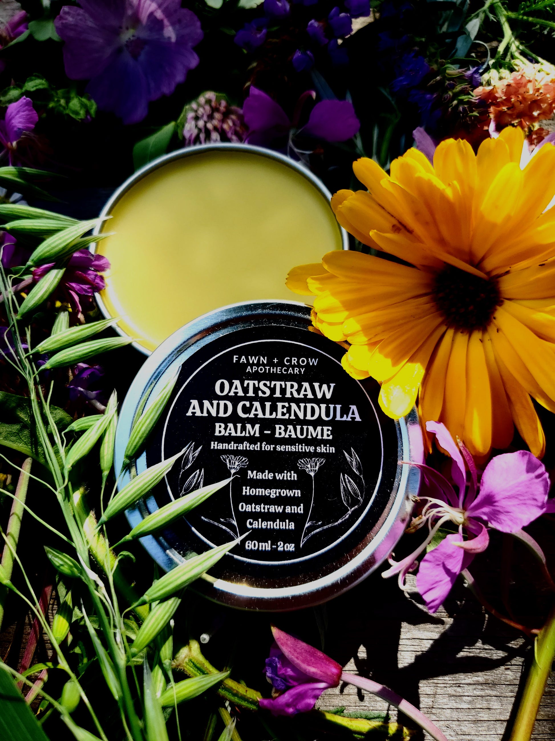 Balm container with flowers and leaves on a dark background