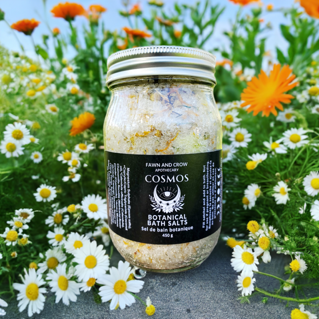 botanical epsom salt blend in a jar surrounded by flowers