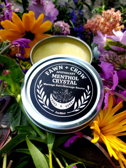 Fawn and Crow Apothecary Menthol Crystal balm tin surrounded by flowers
