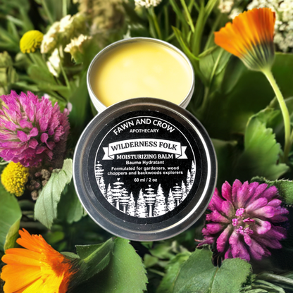 botanical balm with flowers and herbs in background